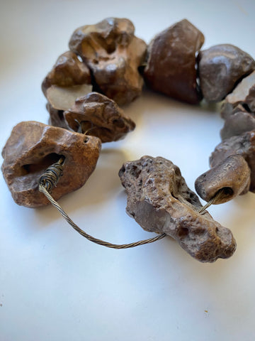 Curious Collection Of Antique Hag Stones Used In Folklore To Ward Off Evil Spirits, Witches & The “Evil Eye”