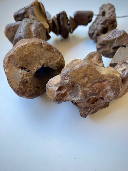 Curious Collection Of Antique Hag Stones Used In Folklore To Ward Off Evil Spirits, Witches & The “Evil Eye”